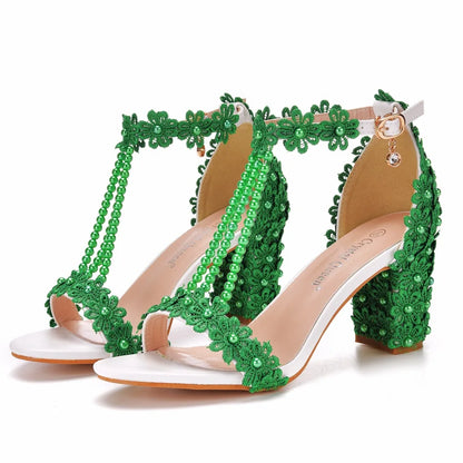 Chic green high heel gladiator sandals for women, adorned with beautiful lace flowers and beads, combining fashion with comfort.