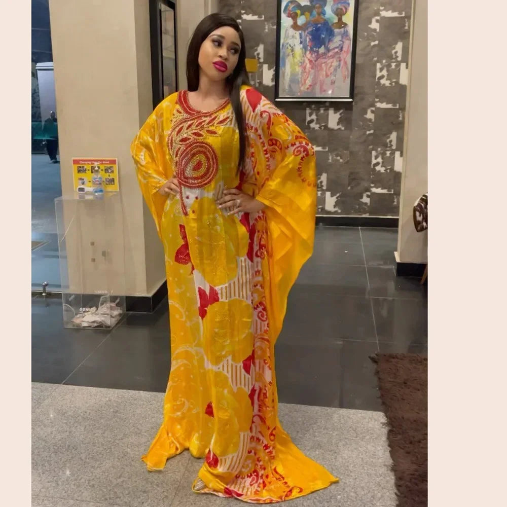Gorgeous long sleeve dashiki abaya boubou robe showcasing vibrant colours and elegant design, perfect for formal occasions or cultural celebrations.