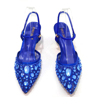 Chic green pump and handbag set displayed together, a perfect match for fashionable women who appreciate luxury.