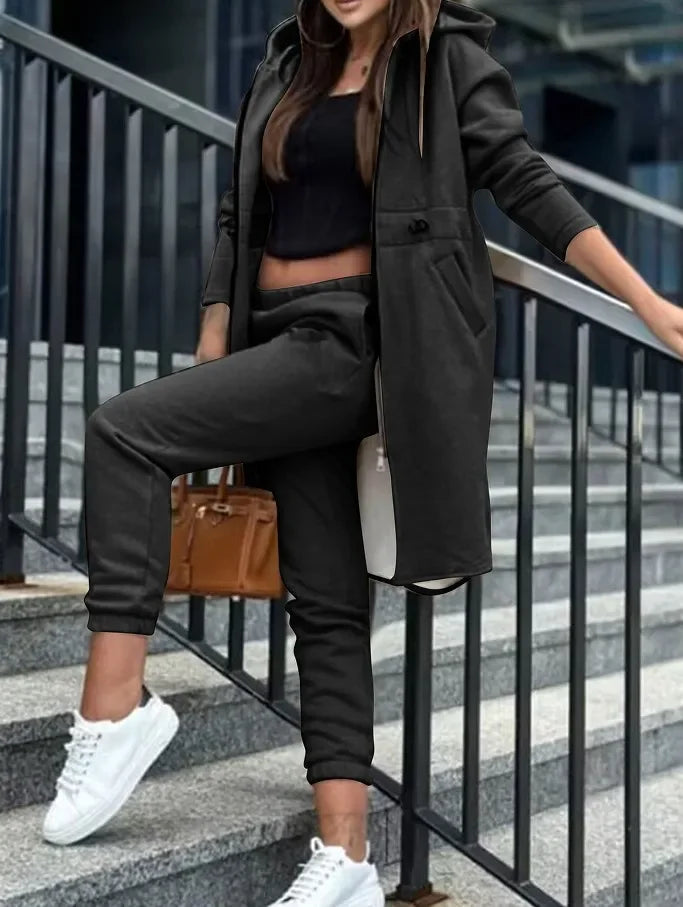 Model showcasing Hot Trends Area's Luxury Women's Hooded Tracksuit Set, perfect for casual outings with its trendy high waist and stylish hood.