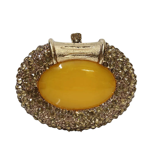 Luxury women's metallic clutch bag adorned with sparkling crystals, ideal for elegant evening outings and parties.