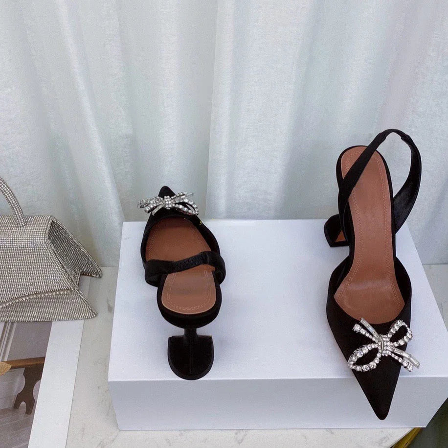 Fashionably designed women's rhinestone bow sandals with super high heels, combining style and comfort for extraordinary occasions.