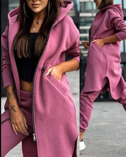 Close-up detail of the luxurious fabric on a women's tracksuit, highlighting the quality of cotton linen and the faux zipper decoration.