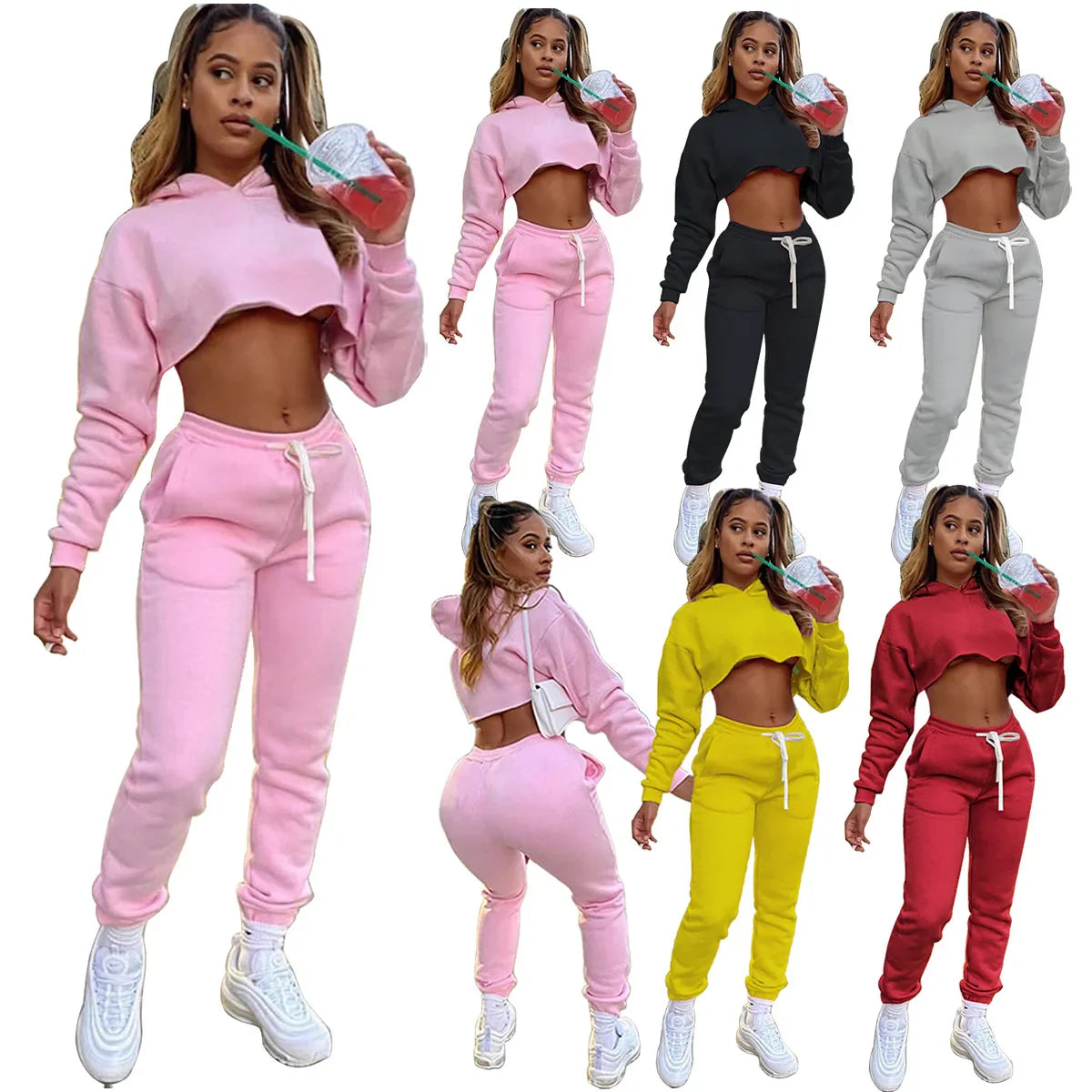 Elegant women's joggers in pink fleece, part of a luxury two-piece running set perfect for winter.