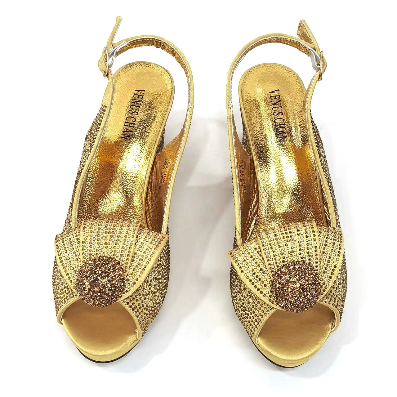 Close-up of the blingy golden wedding shoes from Venus Chan, featuring a stylish buckle strap and peep-toe design.