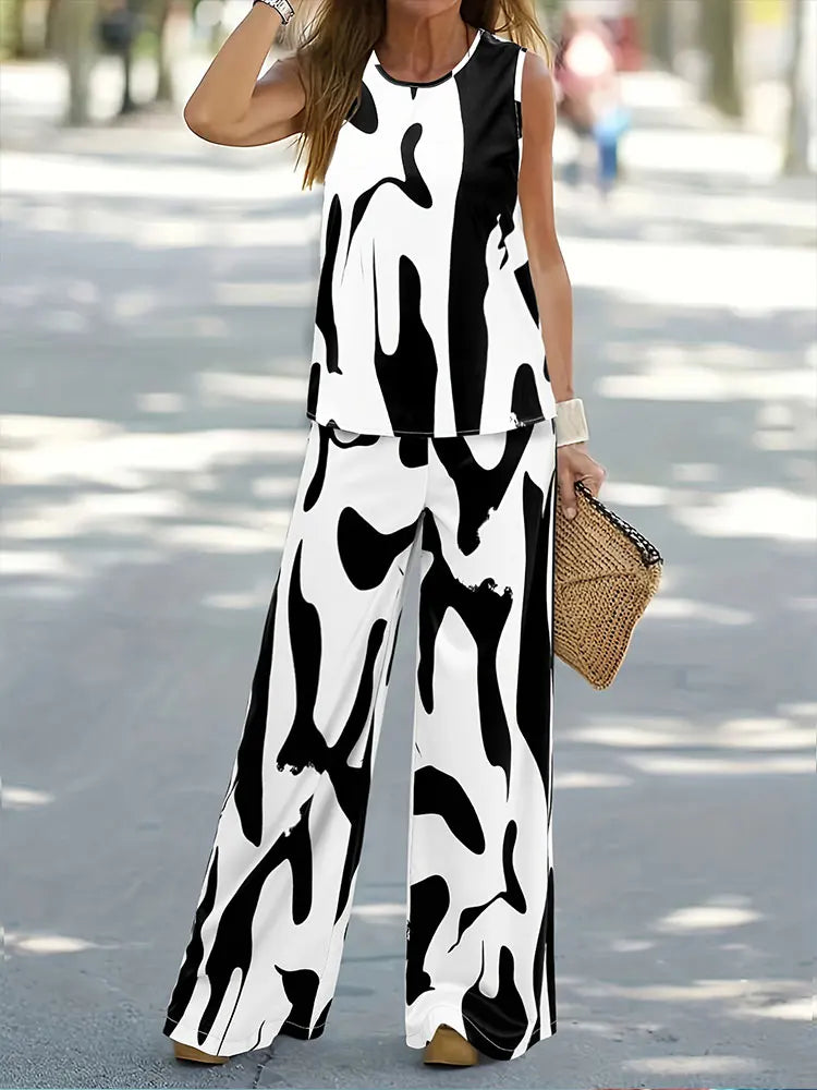 Luxurious women's casual outfit consisting of a loose-fitting sleeveless top and flowing wide-leg pants, crafted from high-quality chiffon.