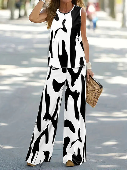 Luxurious women's casual outfit consisting of a loose-fitting sleeveless top and flowing wide-leg pants, crafted from high-quality chiffon.