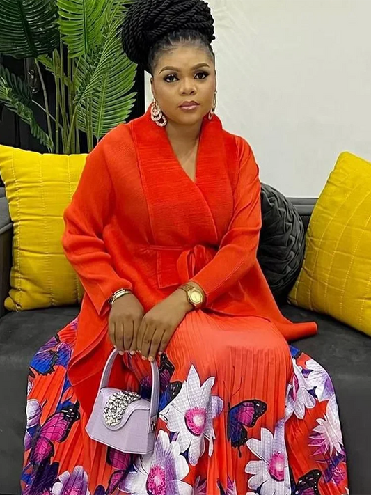 Chic autumn ensemble showcasing a fashionable batwing sleeve shirt paired with an ankle-length pleated skirt, designed for the modern woman.