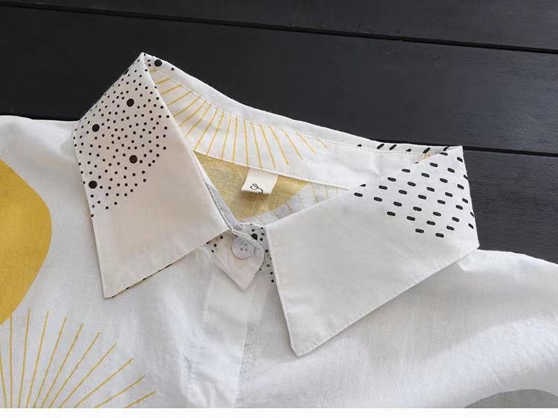 Stylish mid-length women's blouse, offering sun protection with a sophisticated vibe suitable for daytime and evening wear.