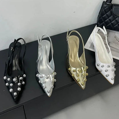 Trendy summer sandals elevating women's footwear with exquisite pointed toe and captivating rivet detailing.