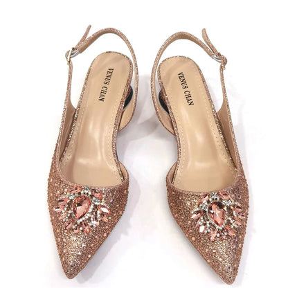 Close-up of the exquisite spike heels and bling fashion element on stylish Italian pumps for women, offering both comfort and elegance.