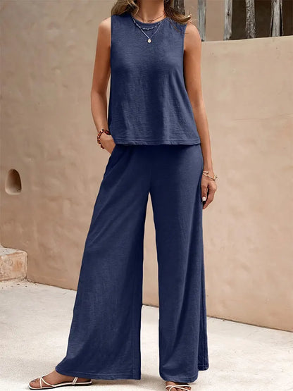 Chic summer outfit for women featuring a floaty chiffon sleeveless top paired with wide leg pants, perfect for sophisticated casual wear.