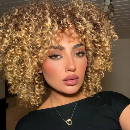 Premium short Afro kinky curly blonde wig with bangs, showcasing a stylish synthetic design for a luxurious look.