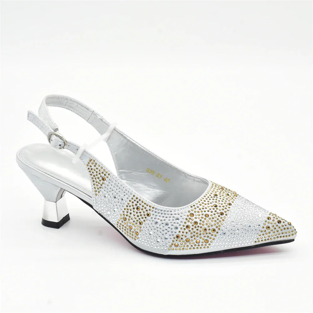 A matching handbag set alongside elegant women's crystal slingback pumps, highlighting exquisite Italian design and chic style.