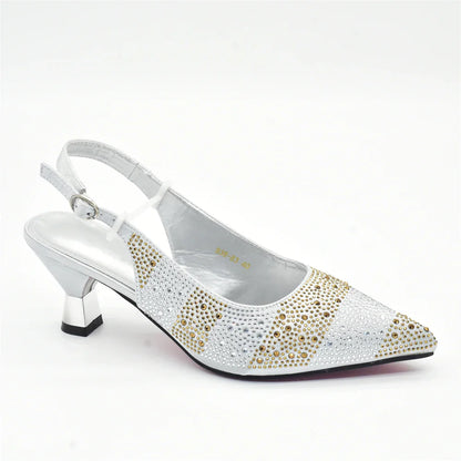 A matching handbag set alongside elegant women's crystal slingback pumps, highlighting exquisite Italian design and chic style.