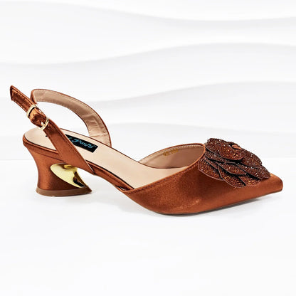 Close-up shot of QSGFC women's pointed toe mid-heel pumps highlighting the luxurious PU material and intricate floral design for a chic evening look.