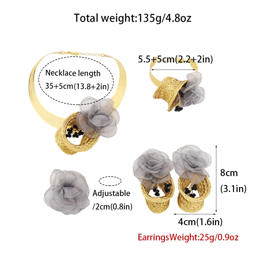 Trendy women’s fashion jewelry set including intricately designed gold earrings, necklace, bracelet, and ring, crafted from metal, ideal for upscale parties and special events.