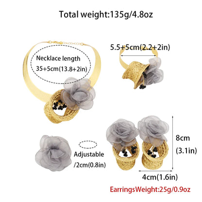 Trendy women’s fashion jewelry set including intricately designed gold earrings, necklace, bracelet, and ring, crafted from metal, ideal for upscale parties and special events.