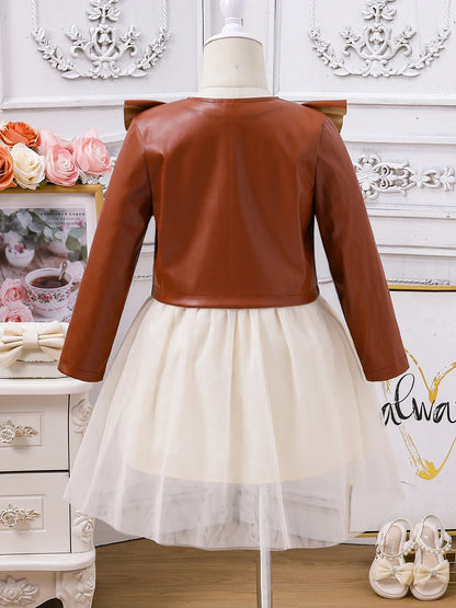 Stylish close-up of the girls' princess skirt with intricate ruched detailing, perfect for autumn fashion.