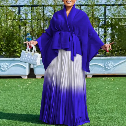 Stylish model showcasing the Luxury Dashiki two-piece women's outfit, featuring rich purple and blue hues, designed to embody elegance at cultural festivities.
