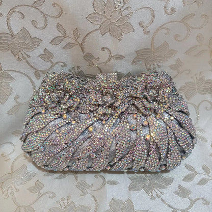Stylish solid design evening clutch for women, featuring high-quality metallic material and a sophisticated look for parties.