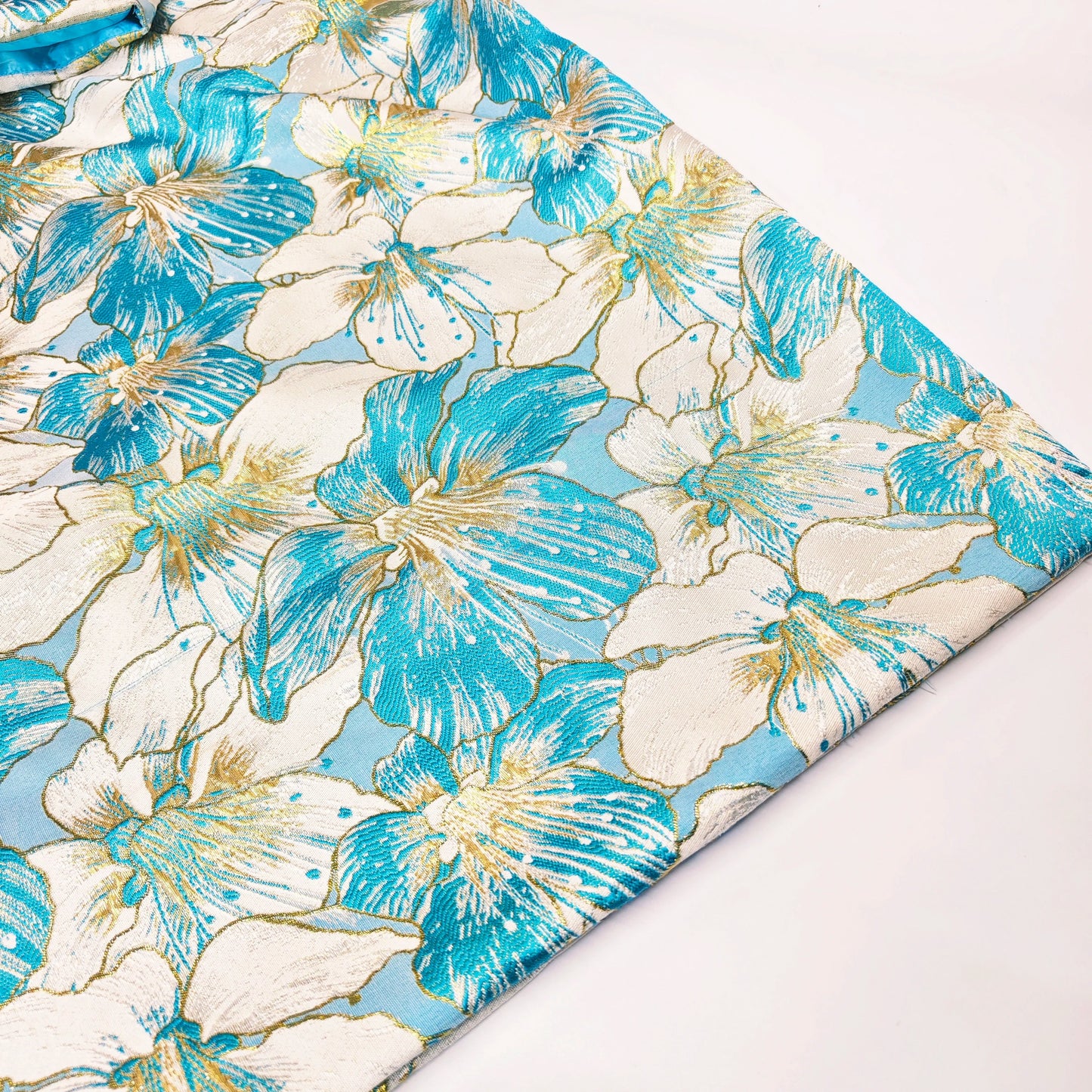 Close-up view of intricate Bazin Riche details on a luxurious African women's Brocade Boubou Dress.