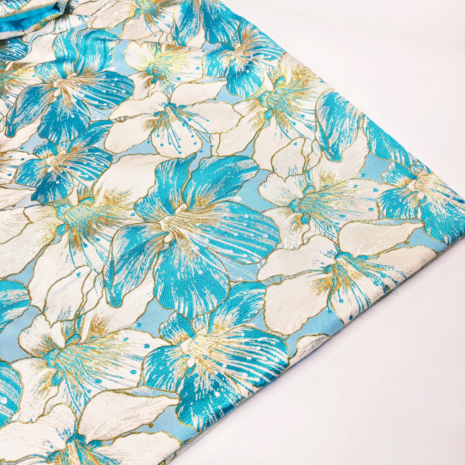 Close-up view of intricate Bazin Riche details on a luxurious African women's Brocade Boubou Dress.