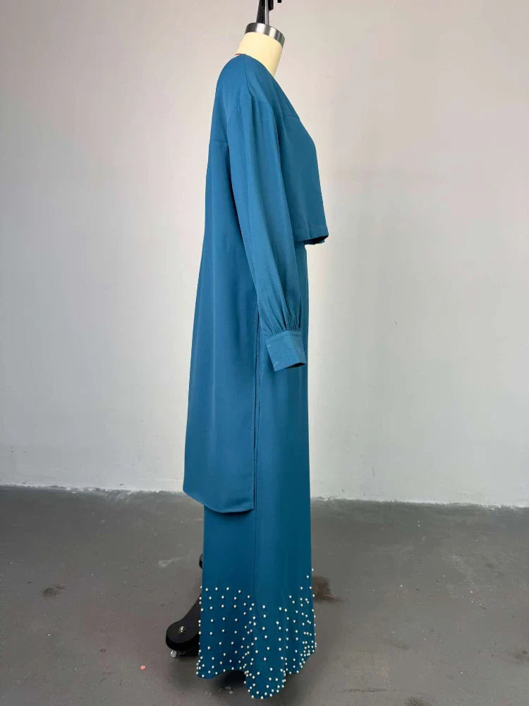 Close-up detail of the embroidered lantern sleeve on the elegant women's top, showcasing intricate design perfect for elevating any casual or party ensemble.