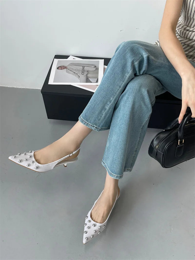 Chic summer sandals with thin heels and slip-on closure, ideal for casual outings and creating fashionable ensembles.