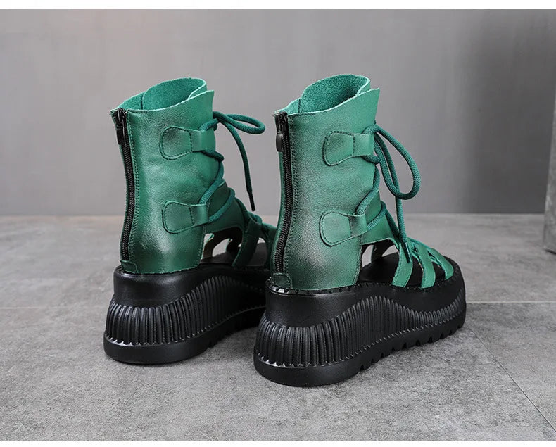 Koznoy Ethnic Cow Leather Hollow Peep Toe Wedge Ankle Booties showcasing luxurious summer fashion with an elegant silhouette.