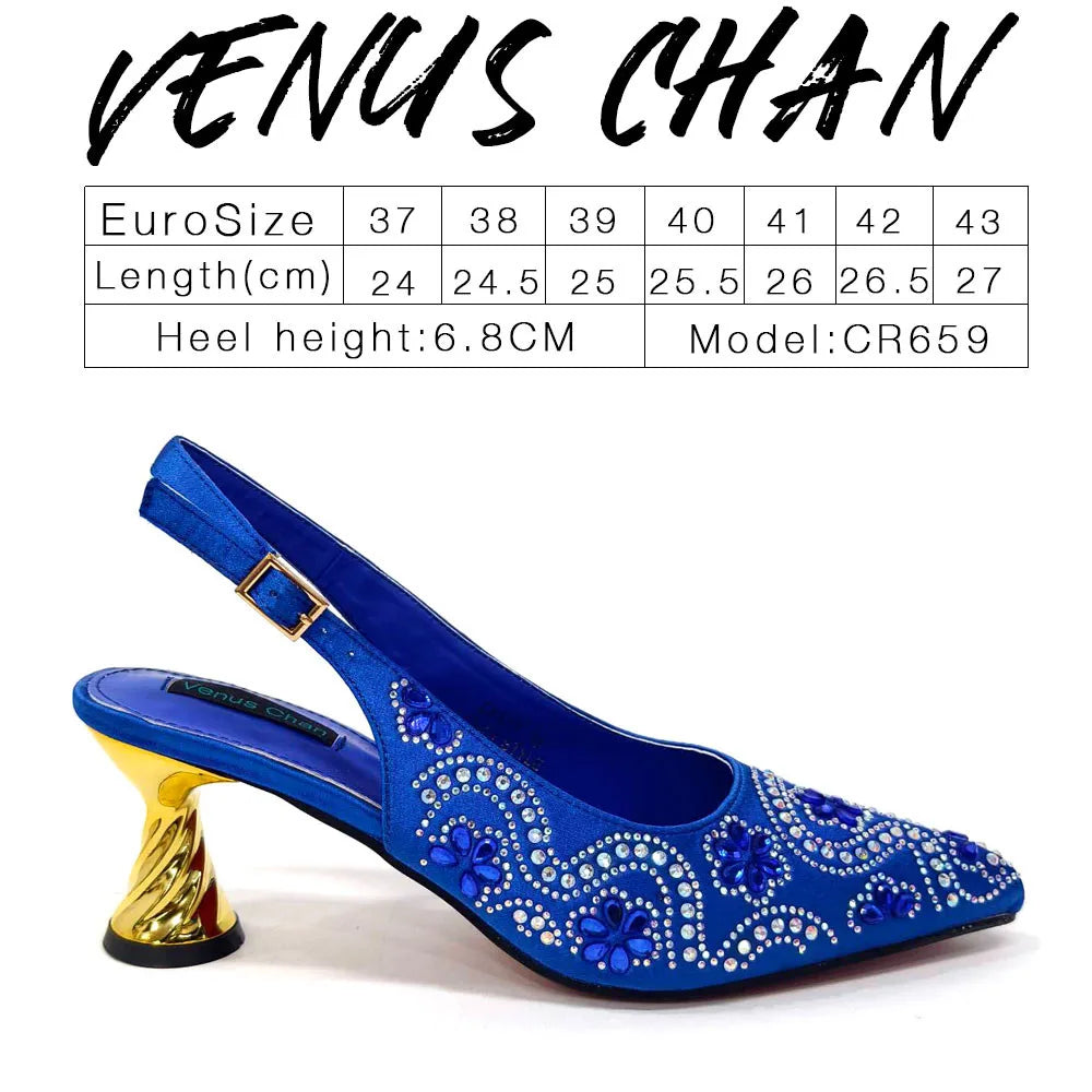 Chic fuchsia handbag with metal handle and long chain shoulder strap, perfect pairing with matching high heels for an upscale look.