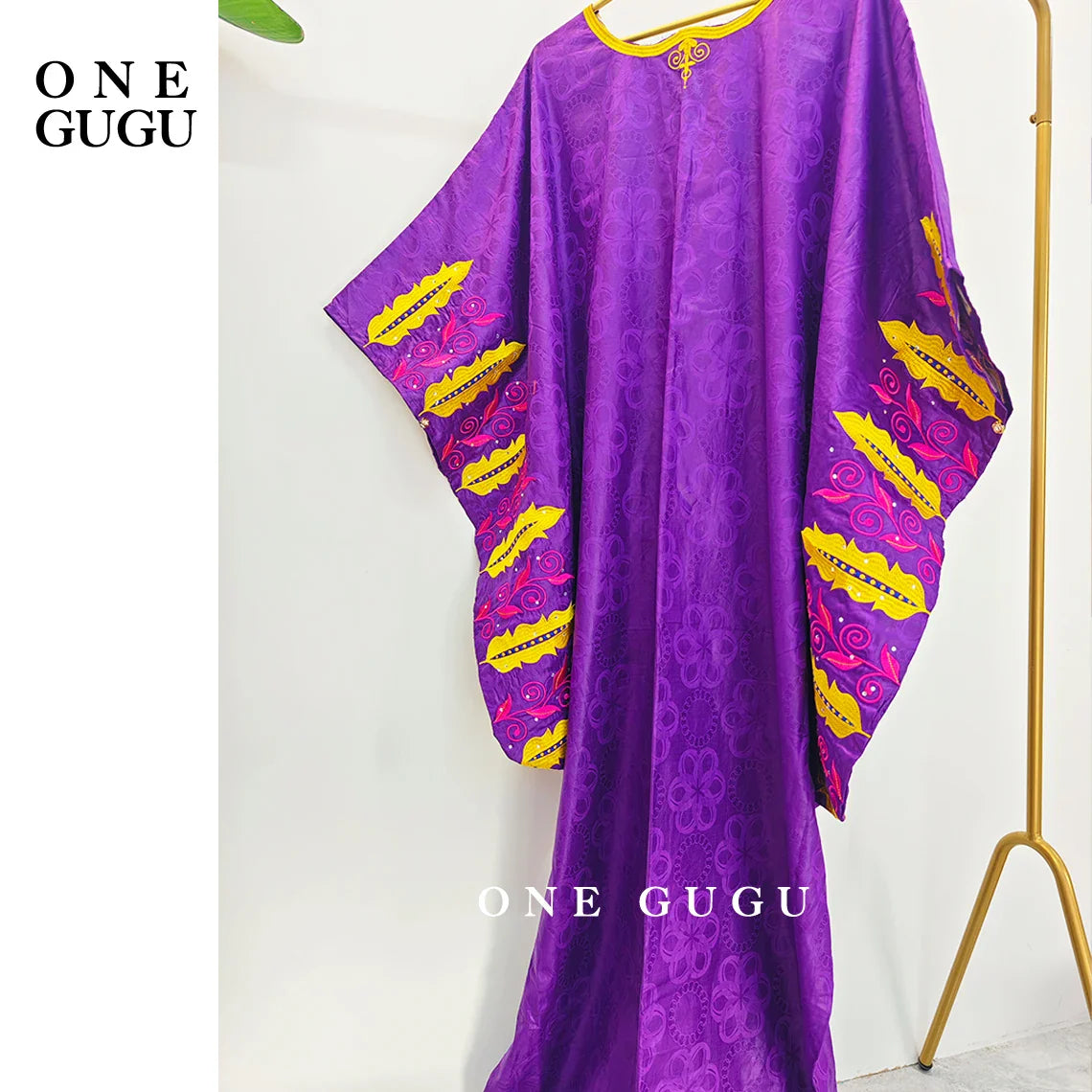 Model showcasing a sophisticated Royal Blue Boubou Dress, an ideal choice for weddings and traditional celebrations.