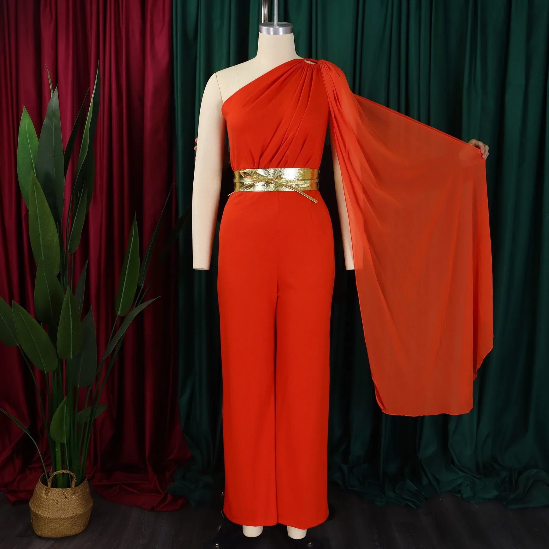 Close-up of high waisted jumpsuit showcasing exquisite fabric details and hollow out decoration, perfect for glamorous occasions.