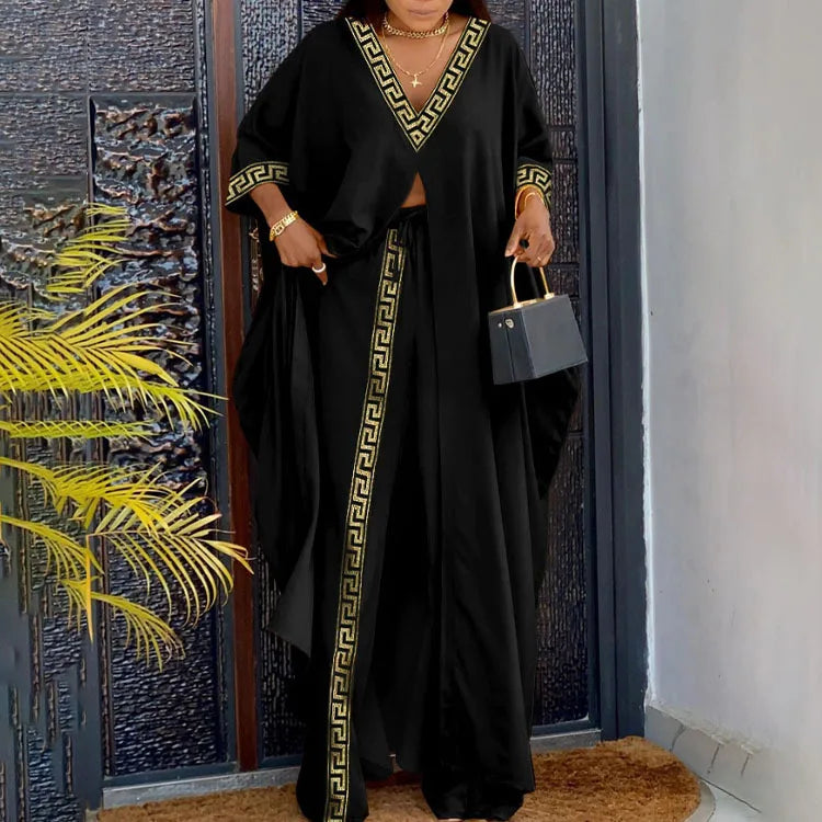 Fashionable women's outfit comprising of a breathable long sleeve top and flowy wide leg pants, tailored for spring/summer elegance.