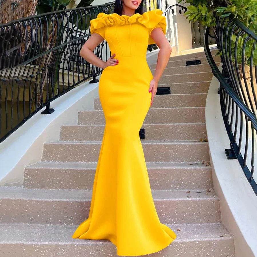 Close-up view of the ruffles on the short sleeves of the off shoulder mermaid dress, exemplifying luxury and sophistication suitable for stylish occasions.