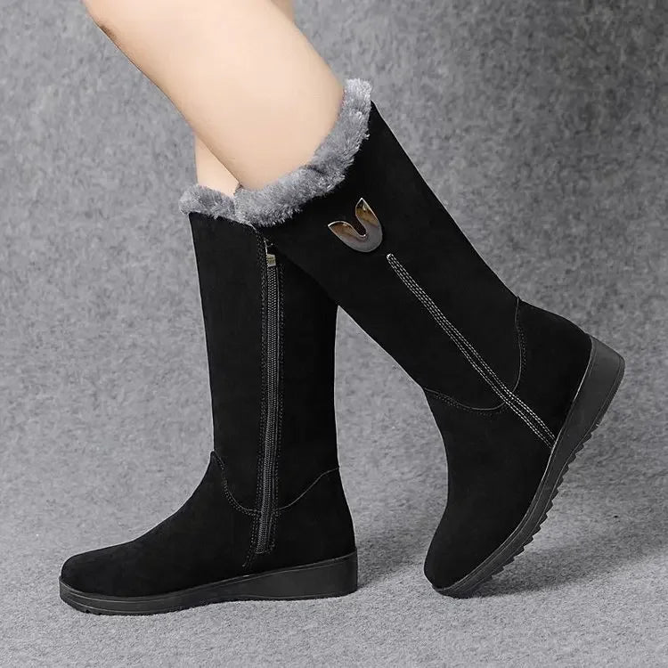 Elegant black women's high fur boots, designed with a modern silhouette and luxurious faux suede, ideal for a fashionable winter look.