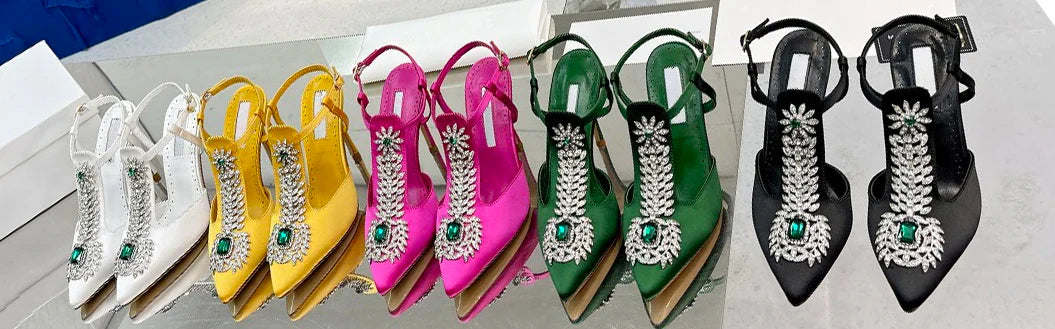 Elegant ladies satin wedding shoes in ivory with rhinestone embellishments, featuring a pointed toe and stiletto heel, perfect for brides on their special day.