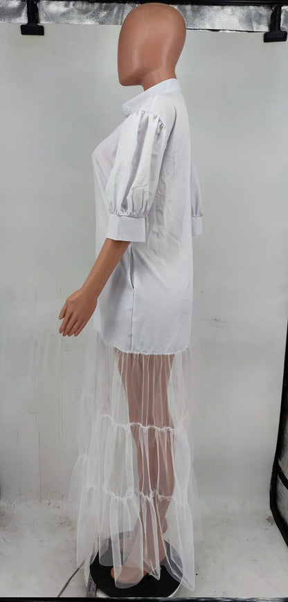 Elegant turn-down collar on a white lace shirt dress, highlighting a blend of contemporary fashion and classic elegance.