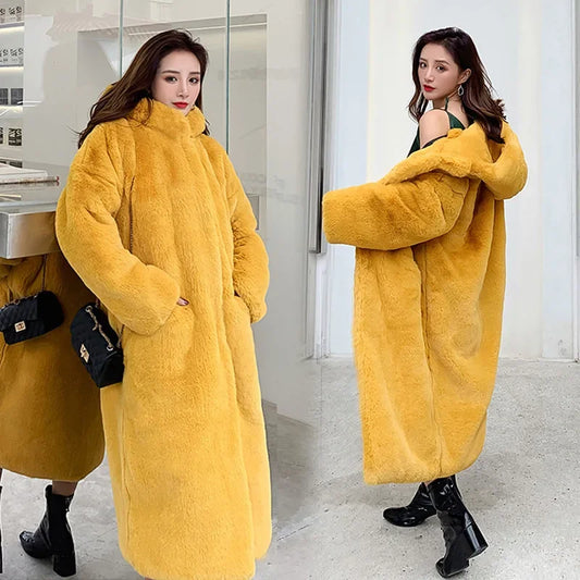 Luxury women's faux fur maxi coat in elegant design with V-neck for autumn and winter styling.
