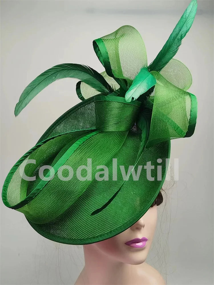 Sophisticated grey pillbox cap fascinator worn by elegant woman, ideal for church ceremonies and cocktail gatherings.