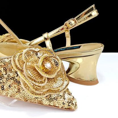 Close-up of QSGFC gold wedding shoes showcasing the luxurious rhinestone and metal decoration for a glamorous look.