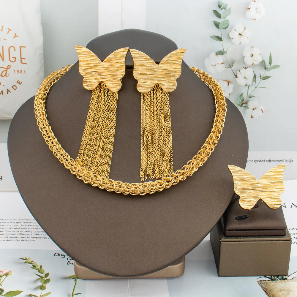 Close-up of luxurious gold detailing on the African fashion jewelry set, including earrings, necklace, and ring, perfect for special events and parties.