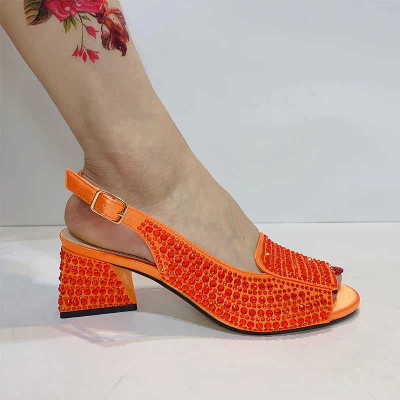 Luxurious Bling Gold Peep Toe Women's Pumps featuring an elegant cross-tied style and high square heel, perfect for sophisticated occasions.