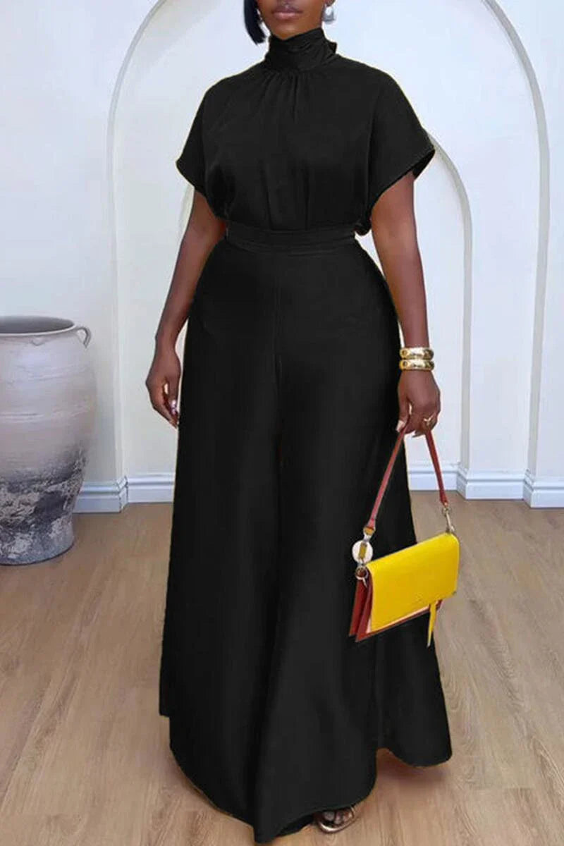 Close-up of luxurious patchwork detail on African women's satin top, reflecting quality and unique design.