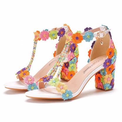 Elegant luxury plus size women's high heel gladiator sandals adorned with intricate lace flowers and decorative beads, perfect for formal occasions.