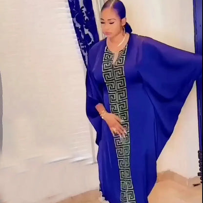 Model wearing the elegant V Neck Maxi Dress in a Spring/Summer setting, exemplifying timeless luxury and style for modern women.