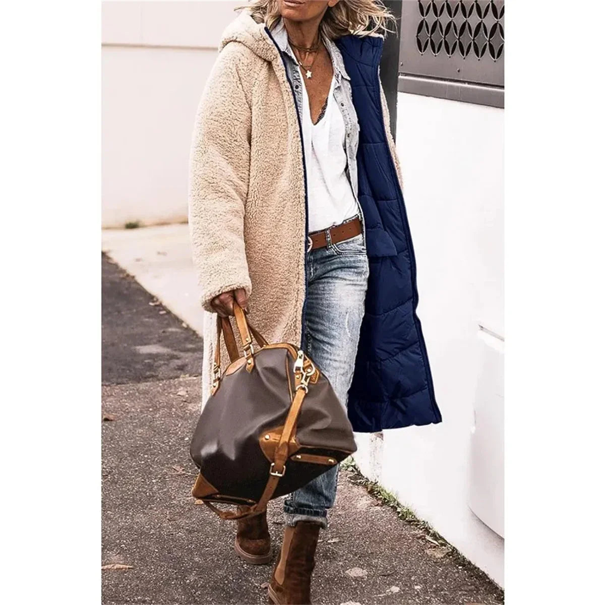 Luxury women's hooded thick quilted long sleeve winter jacket, featuring stylish pockets and a reversible design, perfect for elegant winter wear.