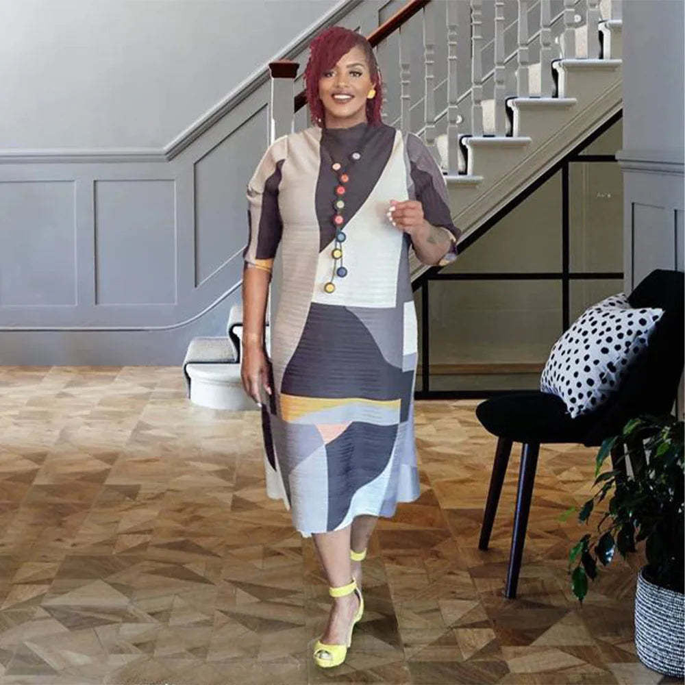 Chic plus size African long dress with a flattering O-neck and luxurious pleats, ideal for formal and cultural events.