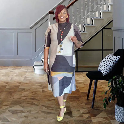 Chic plus size African long dress with a flattering O-neck and luxurious pleats, ideal for formal and cultural events.