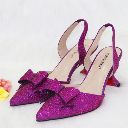 Elegant women's purple embellished pointed toe pumps, featuring spike heels and a comfortable fit, perfect for sophisticated events.